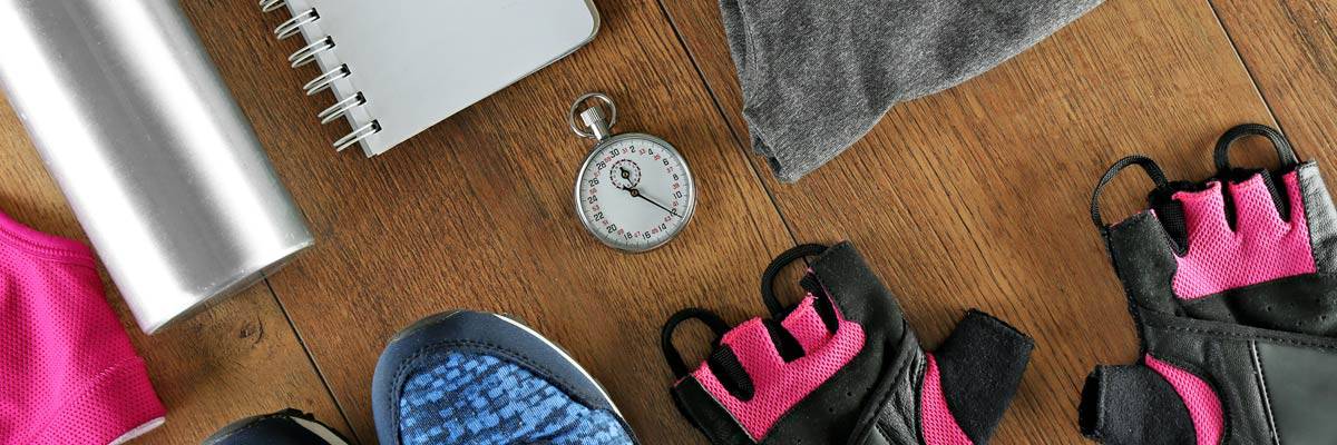 Gym clothes, diary and watch - break from fitness training