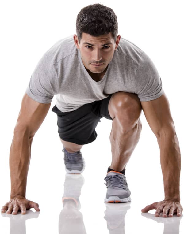 An athletic man ready to start running